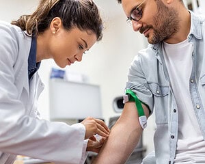 Medical professional taking patient's blood