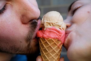 Ice cream cone kiss. Couple sharing ice cream cone. Don't let digestive issues put the breaks on your love life. 